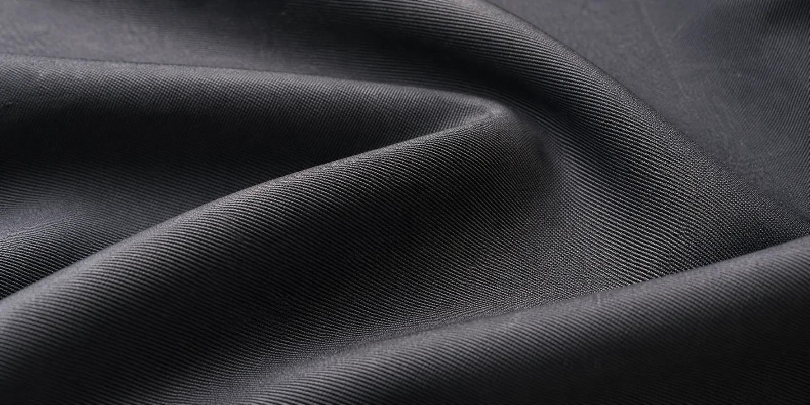 Close-up of gabardine fabric showing its signature diagonal twill weave