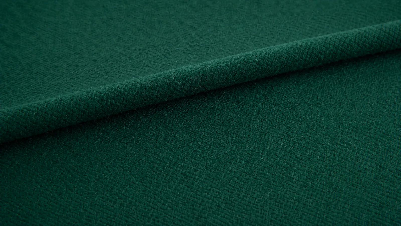 Close up texture of green baize fabric showing its woven, napped surface